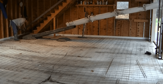 Repairing a sunken and damaged concrete garage floor by leveling and resurfacing